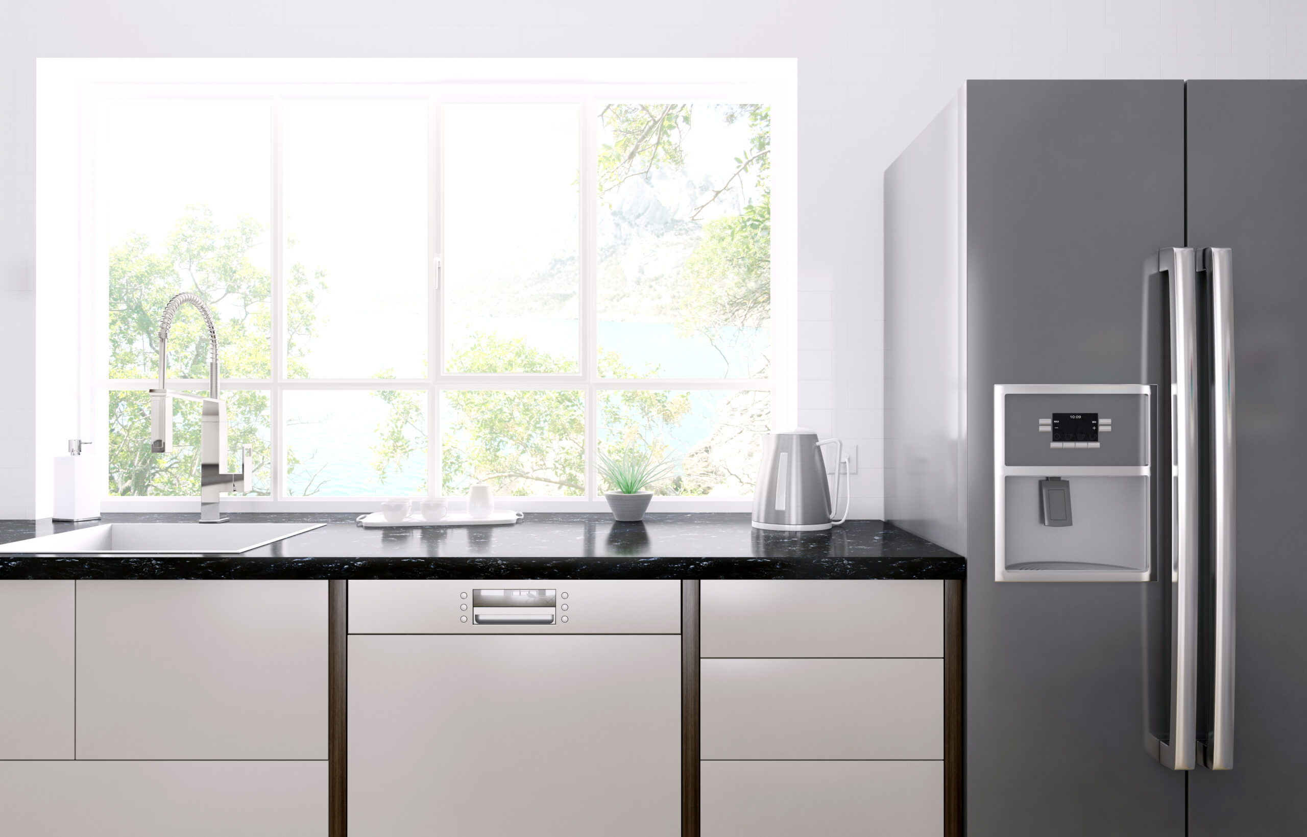 Interior of modern kitchen with black granite counter, refrigerator with ice maker and dispenser